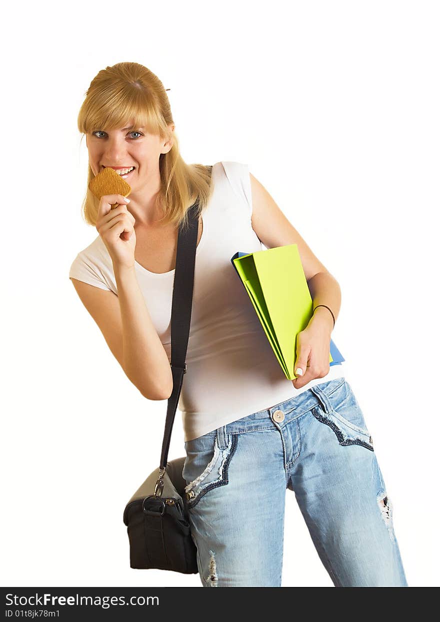 Portrait of a young attractive student it eats cookies on the white background. Portrait of a young attractive student it eats cookies on the white background