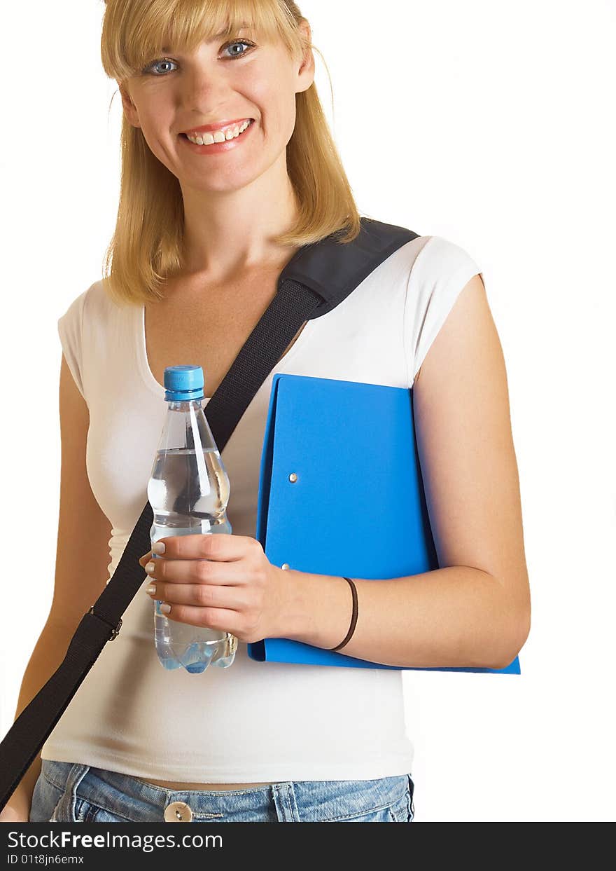 Portrait of a young attractive student, it holds a bottle with water on the white background. Portrait of a young attractive student, it holds a bottle with water on the white background