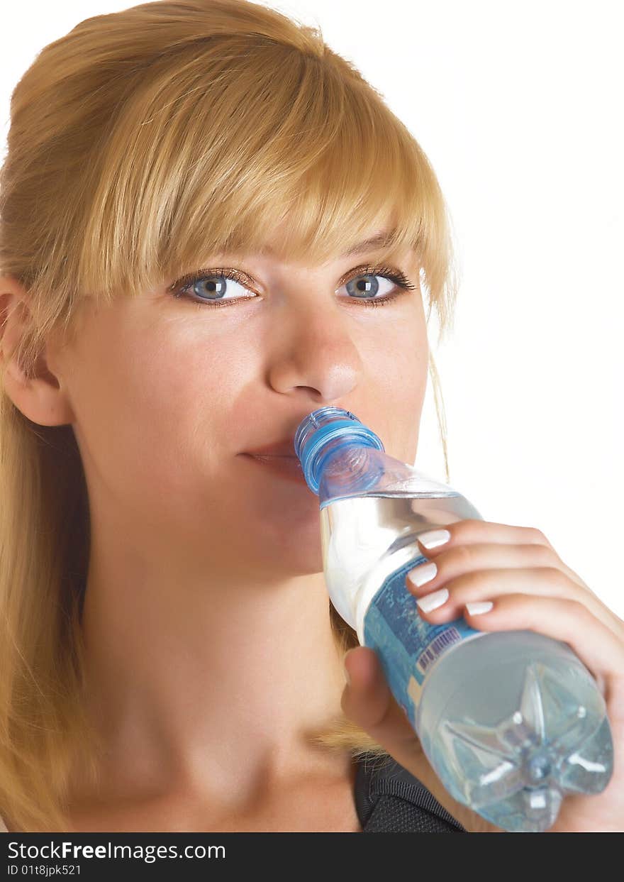 Woman drinking water on the white background. Woman drinking water on the white background