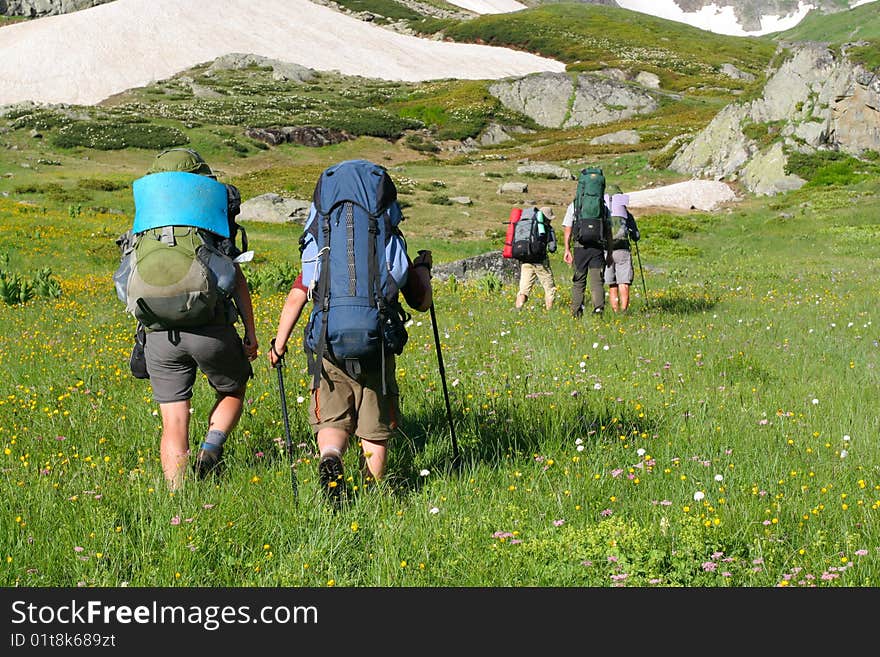 Hikers family in Caucasus mountains