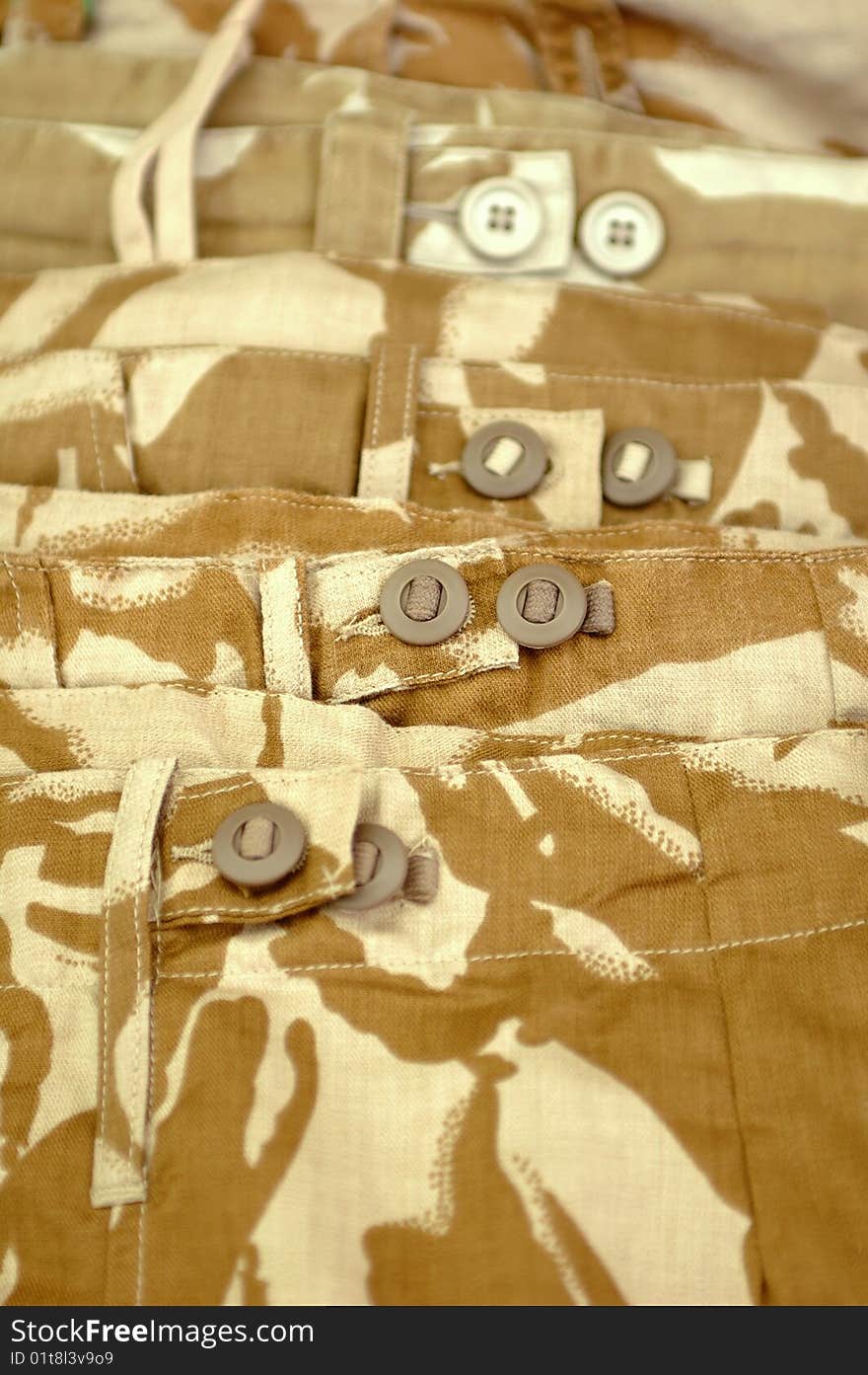 Beige military desert camouflage clothing close-up