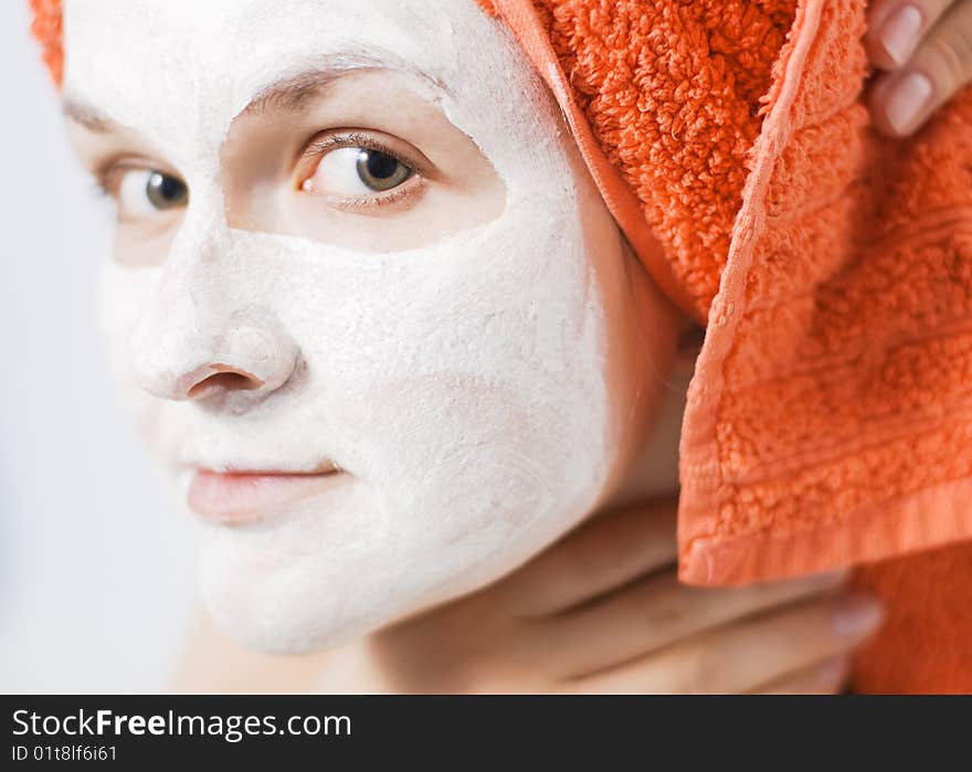 Young woman with face pack