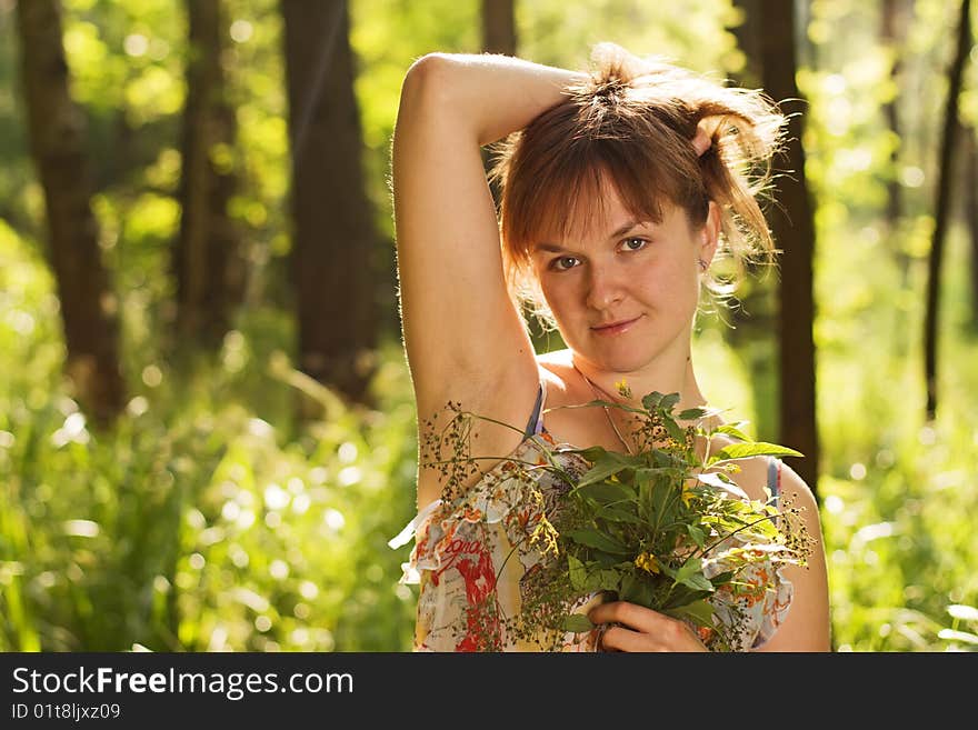 Girl with flowers in the forest. Girl with flowers in the forest