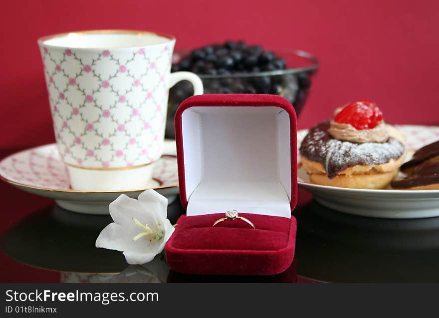 Romantic breakfast with a cake,coffee and wedding ring