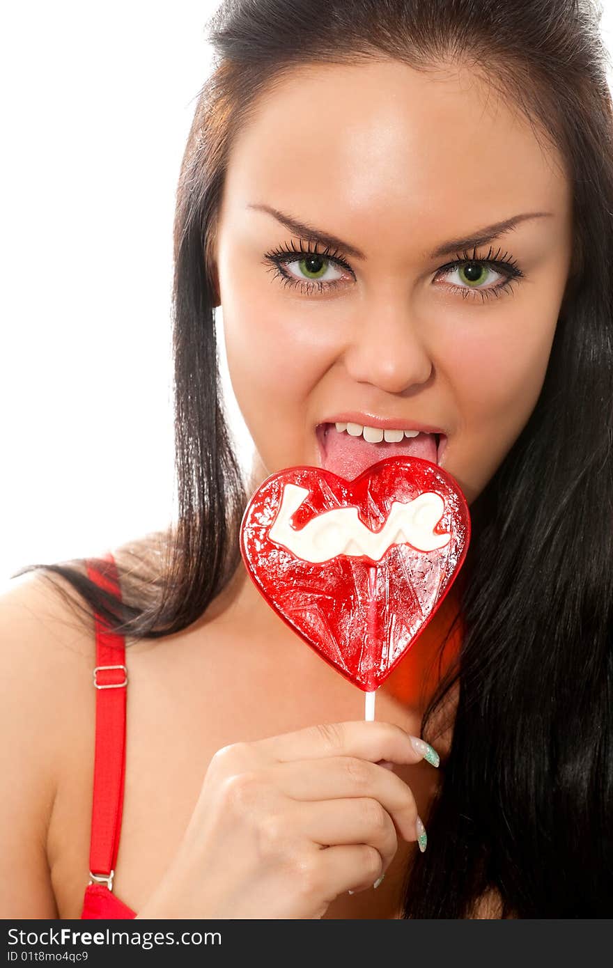 Closeup portrait of young brunette woman with lollipops isolated on white