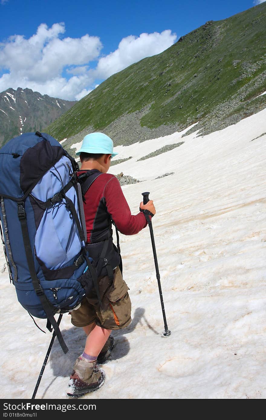 Hiker boy in Caucasus mountains