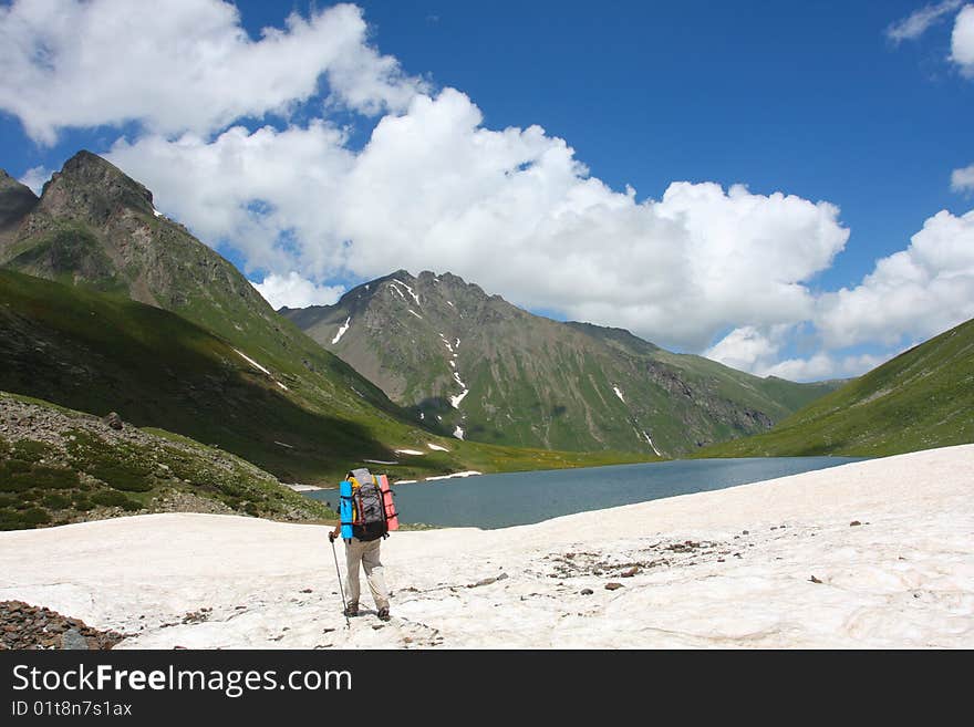 Hiker boy in Caucasus mountains