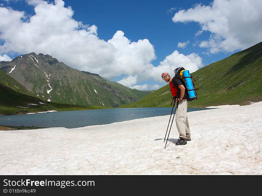 Hiker boy in Caucasus mountains