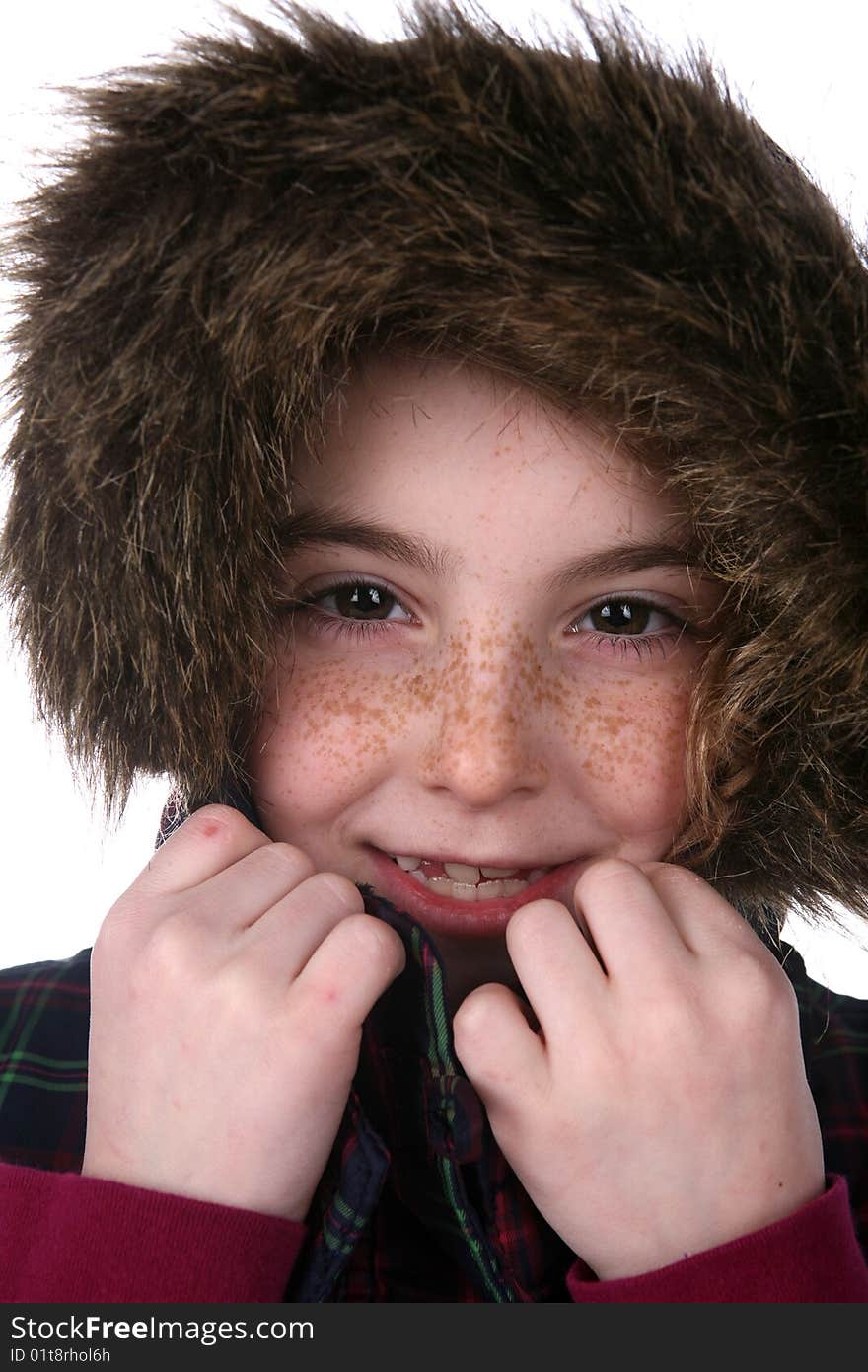 Cute girl with freckled face in warm,fuzzy hoot. Cute girl with freckled face in warm,fuzzy hoot