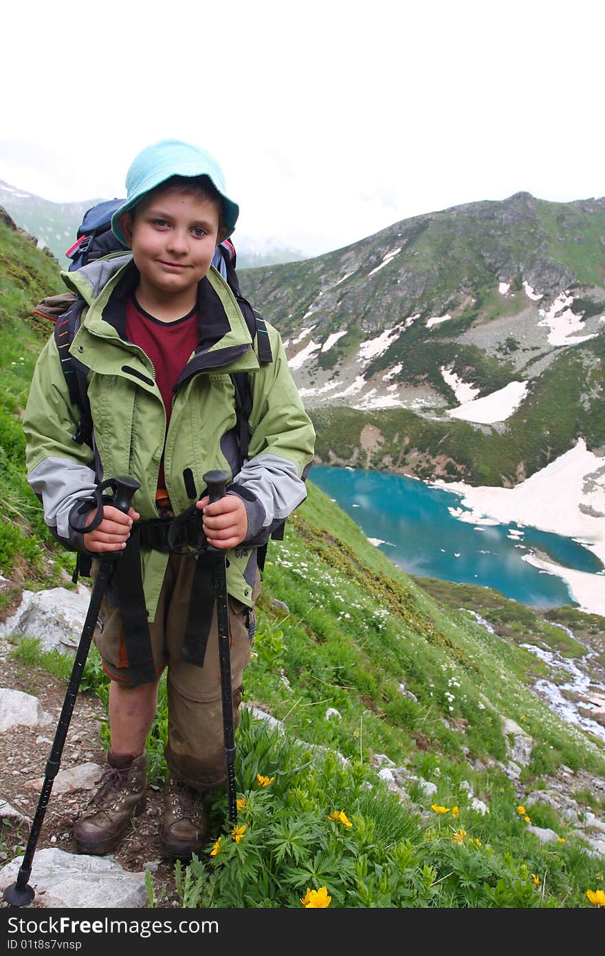 Hiker boy in Caucasus mountains