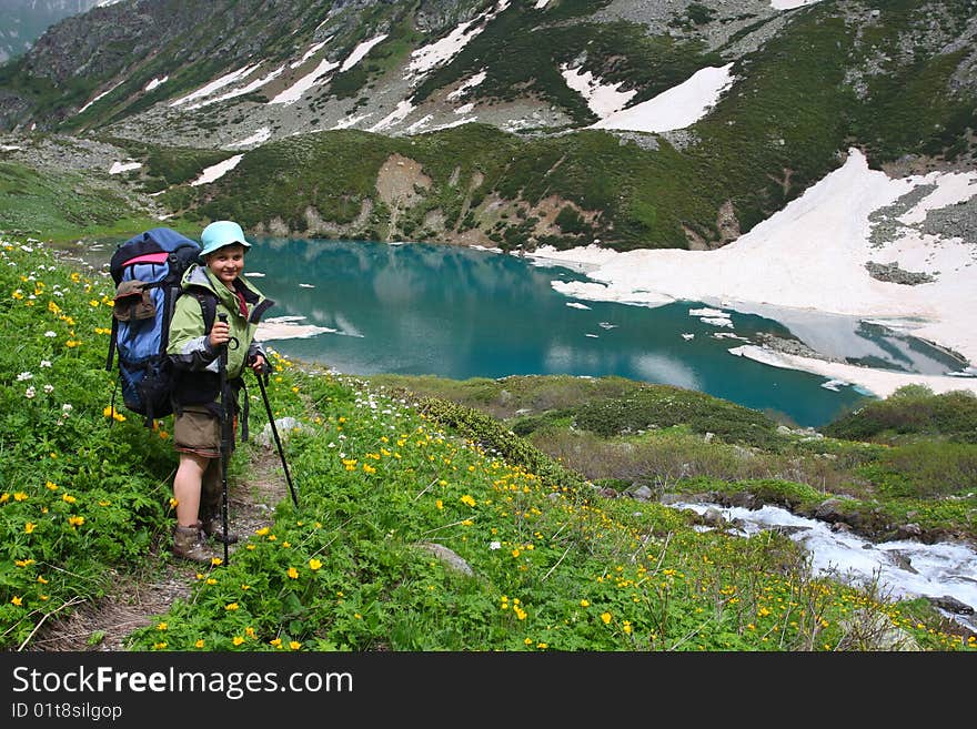 Hiker boy in Caucasus mountains