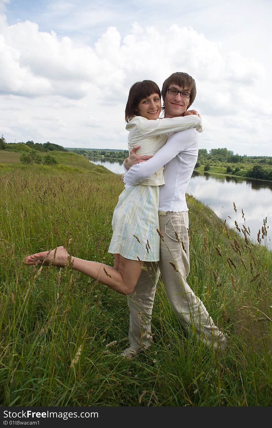 Boy and girl on a green grass. Boy and girl on a green grass