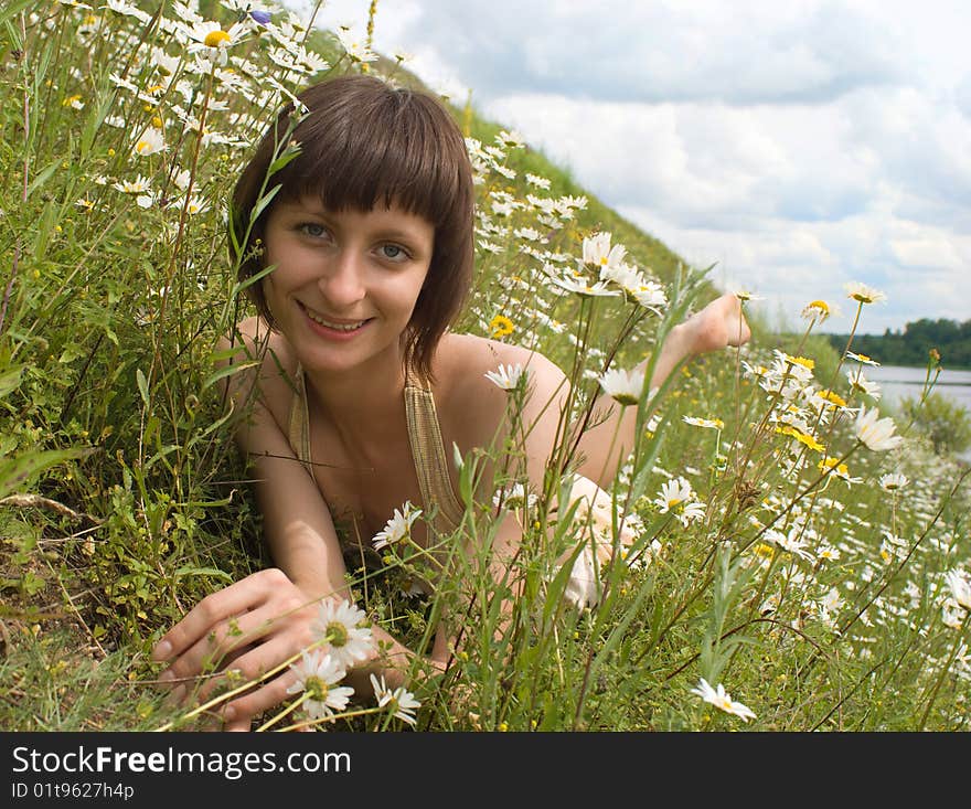 The portrait of girl in the middle of flower (bank of river). The portrait of girl in the middle of flower (bank of river)