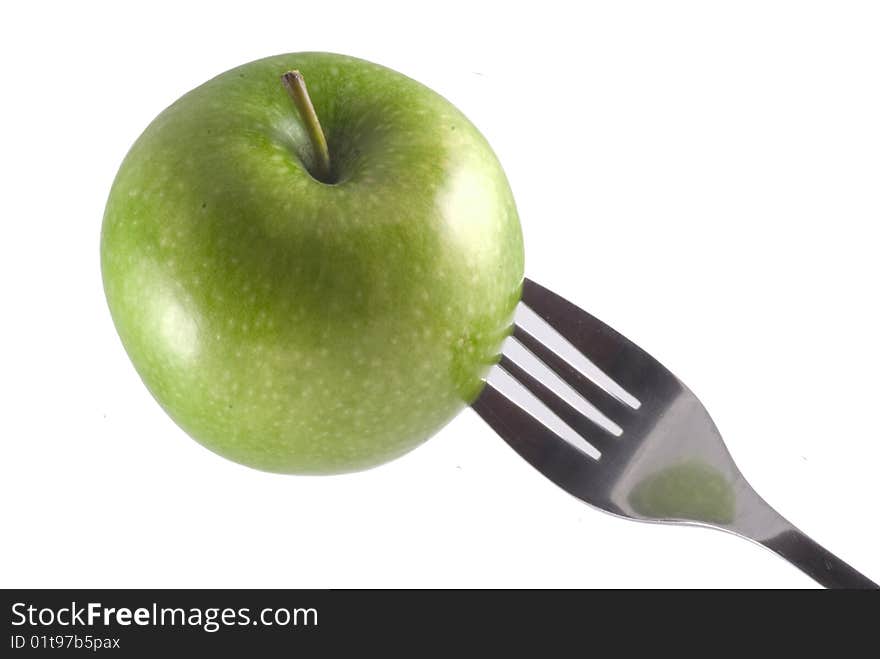 An apple on a fork.