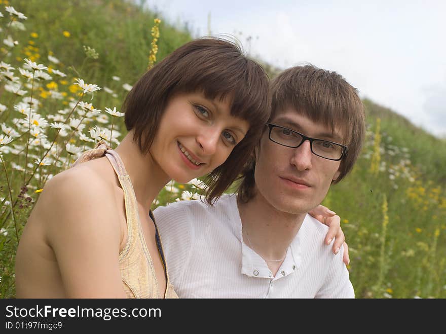 Boy and girl on a green grass. Boy and girl on a green grass