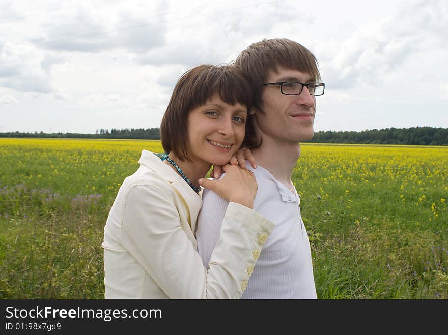 Boy and girl on a green grass. Boy and girl on a green grass