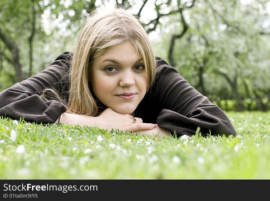 Beautiful girl resting in the spring garden