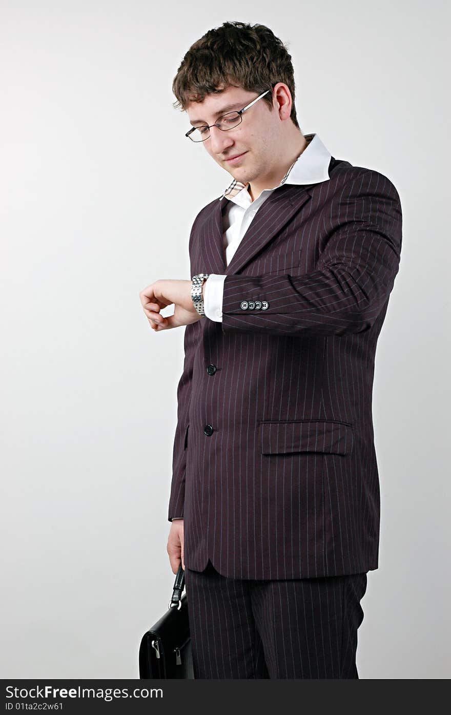 Businessman watching wristwatch