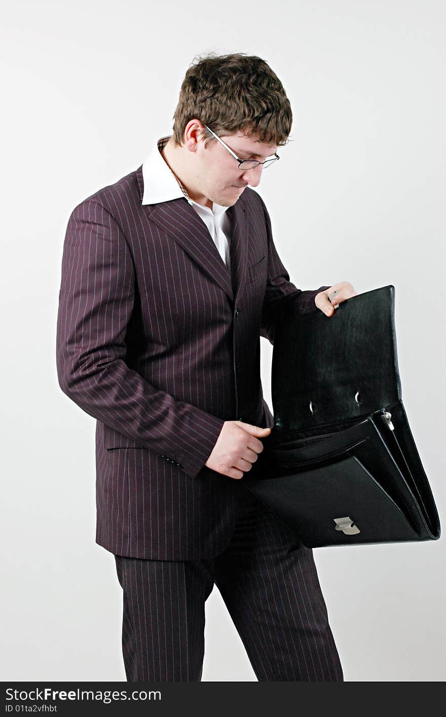 Businessman looking into bag