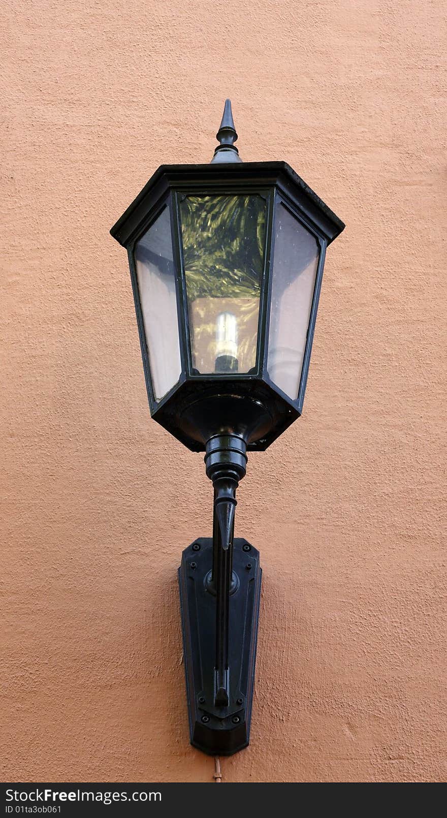 Street lamp hang on brown wall