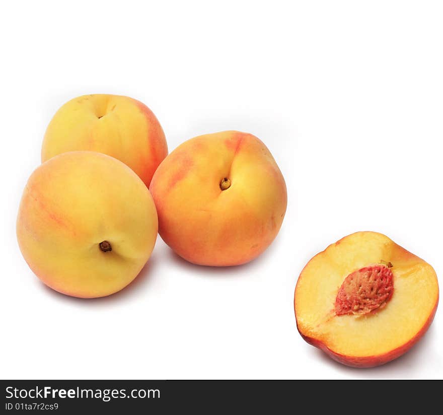 Ripe sweet peaches on white backgroun