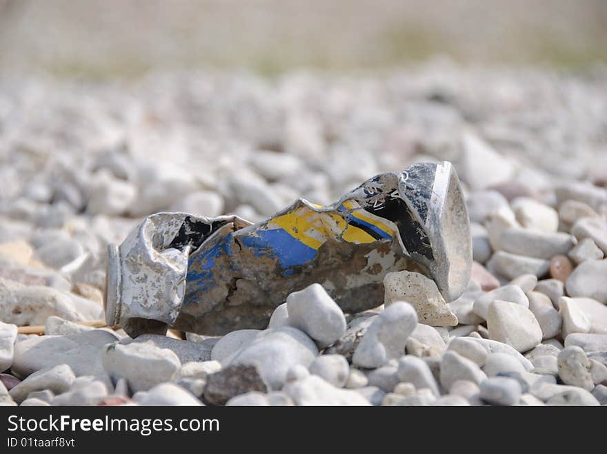 Metal rubbish on white rocks