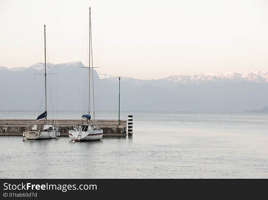 Two sailboats at the Garda lake in Italy