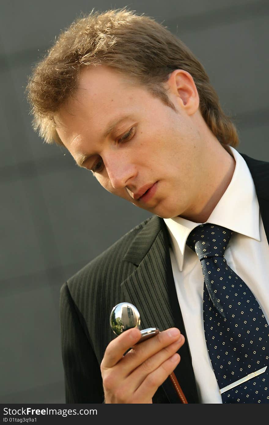 Businessman looking at his pocket watch. Businessman looking at his pocket watch