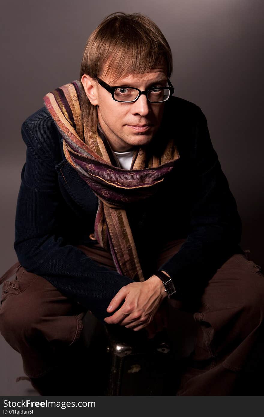 Man in scarf looking up separated