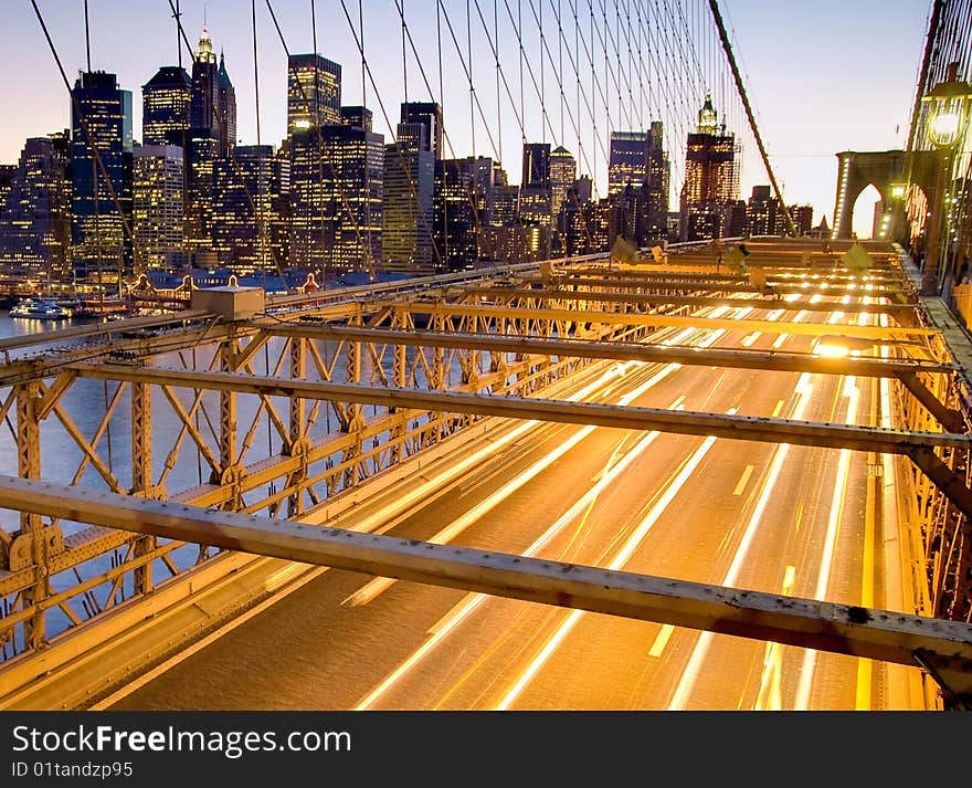 View of the Brooklyn Bridge and Financial District at Sunset in New York city, USA.