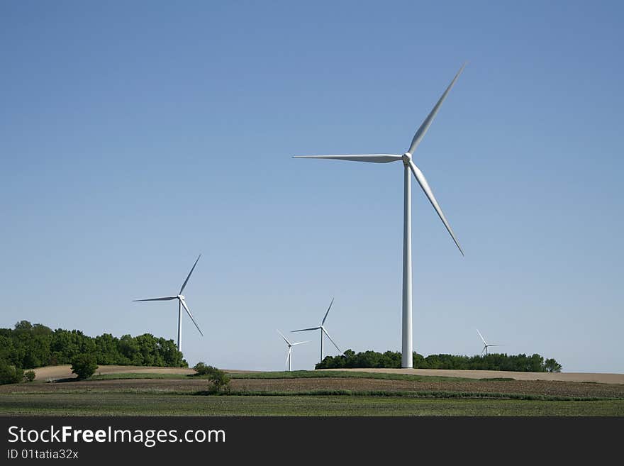 Wind turbine with grass in foreground. Wind turbine with grass in foreground