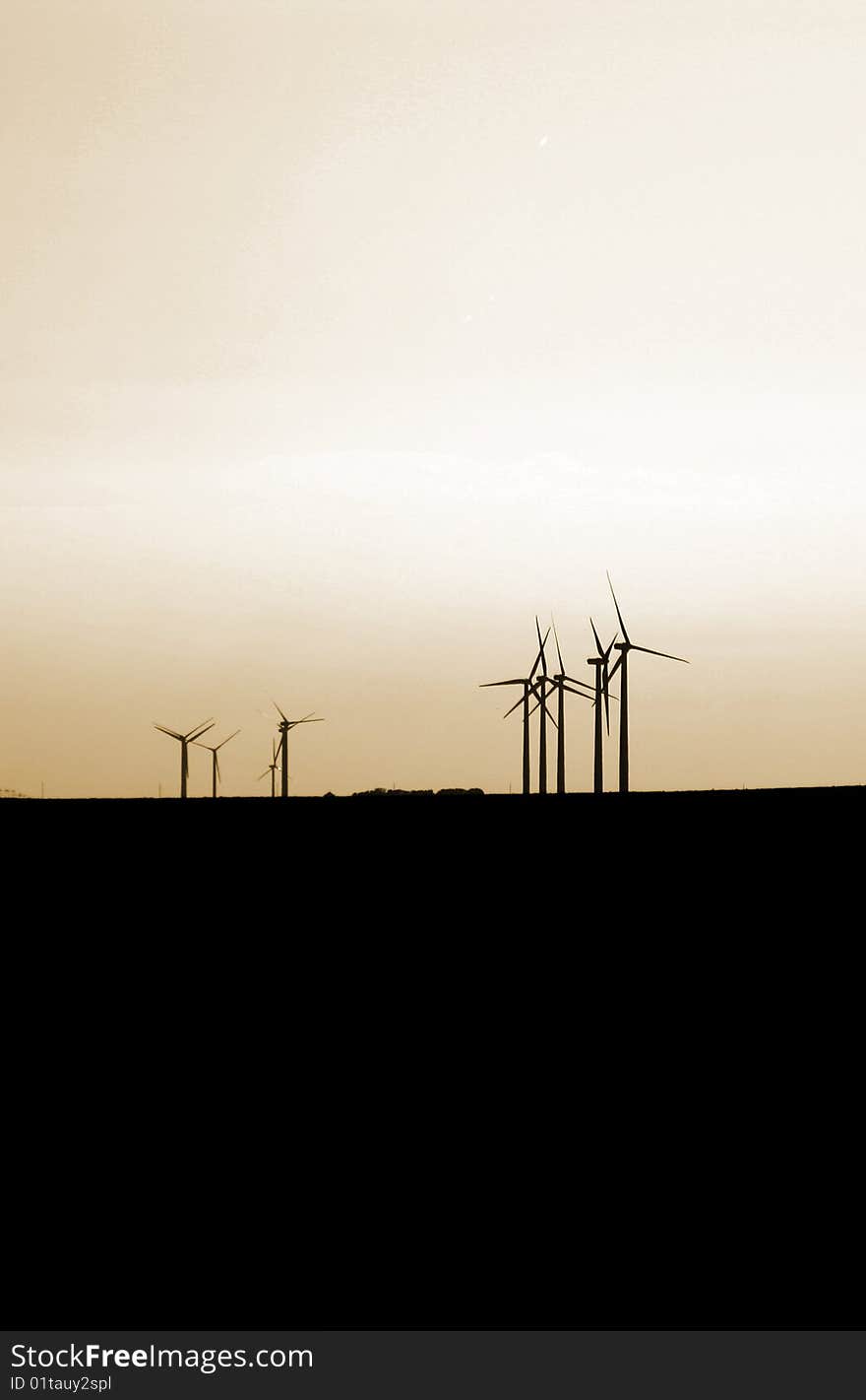 Wind turbines on an orange sky. Wind turbines on an orange sky