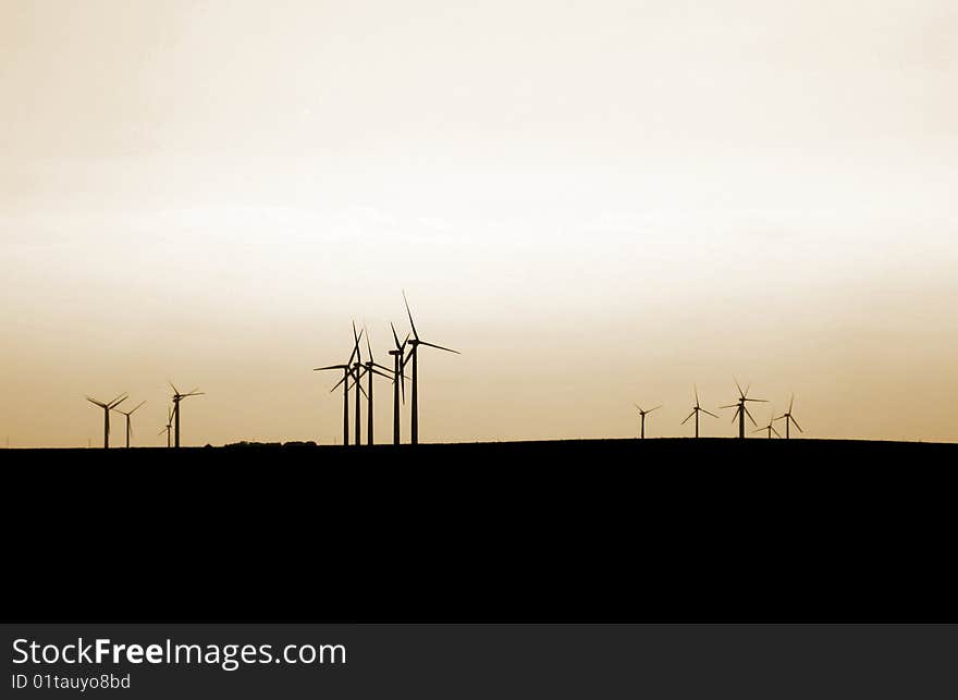 Wind turbines on an orange sky. Wind turbines on an orange sky