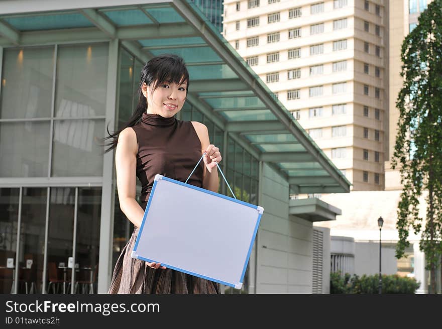 Beautiful young and modern Asian woman in the city.