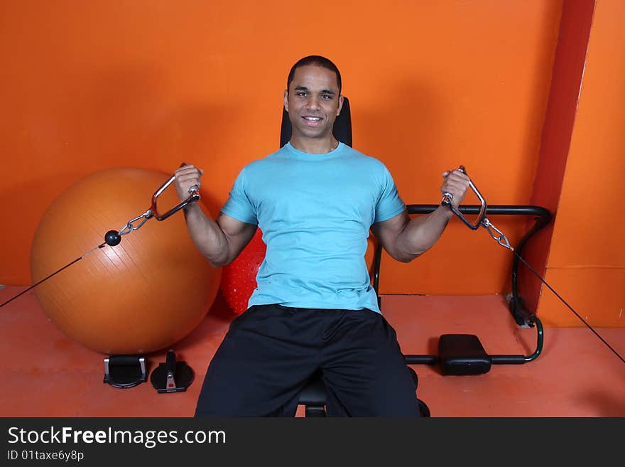 Young man working out at the gym. Young man working out at the gym