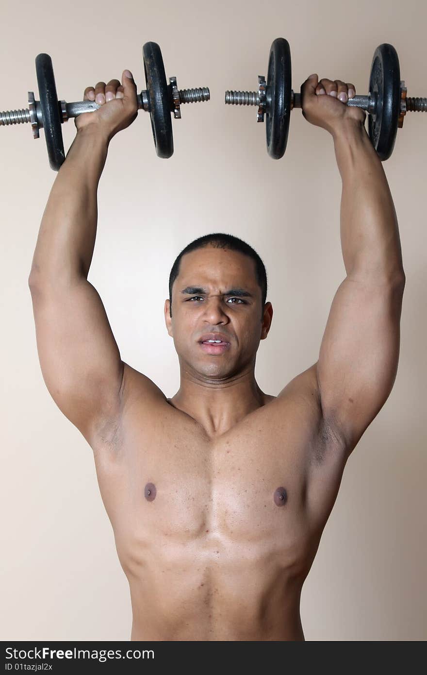 Muscular Male Body, Lifting Dumbbells