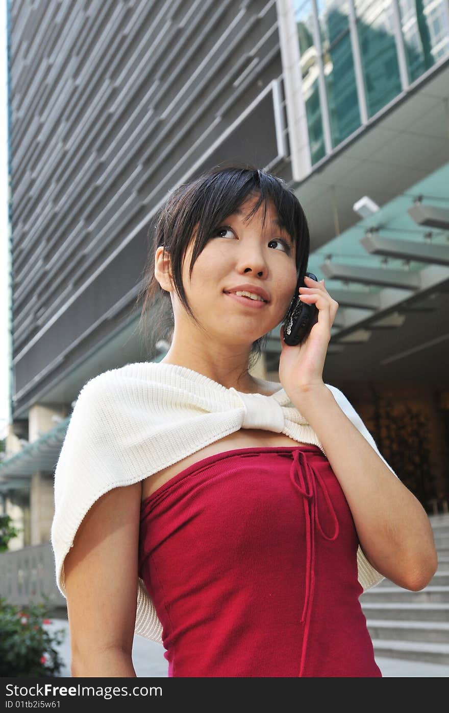 Asian Chinese Woman Answering Her Mobile Phone