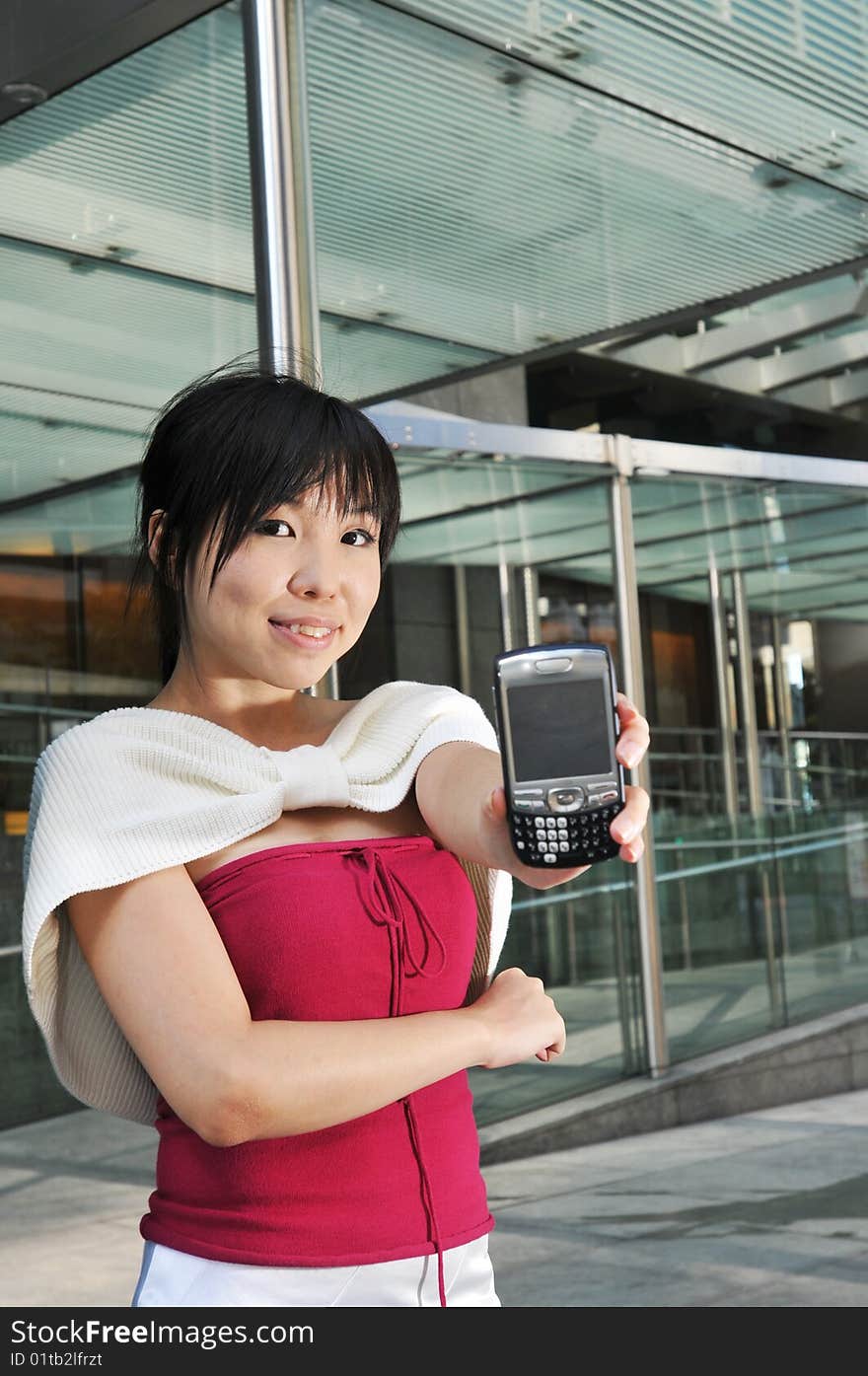 Beautiful young and modern Asian woman in the city.