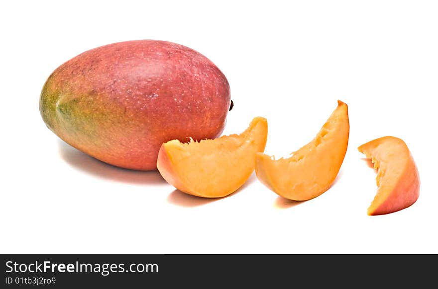 Mango and three segments isolated on white background