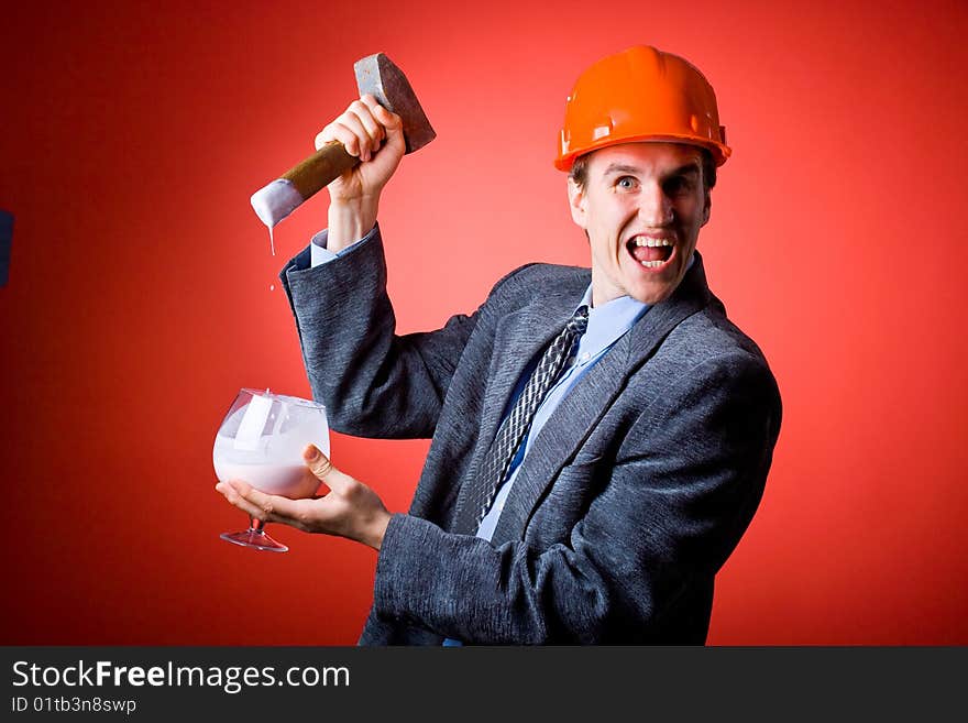 The man in a helmet with a hammer and yoghurt