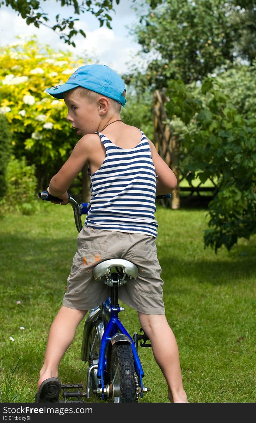 The child of outdoor goes for a drive on bicycle. The child of outdoor goes for a drive on bicycle