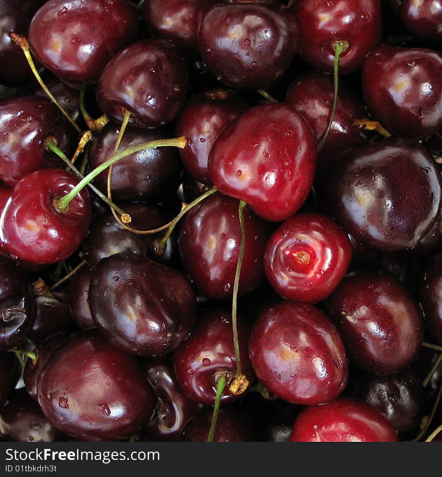 Fresh cherries covered with water droplets