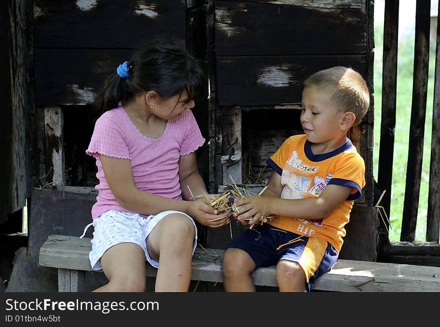 Small children playing with eggs and fan