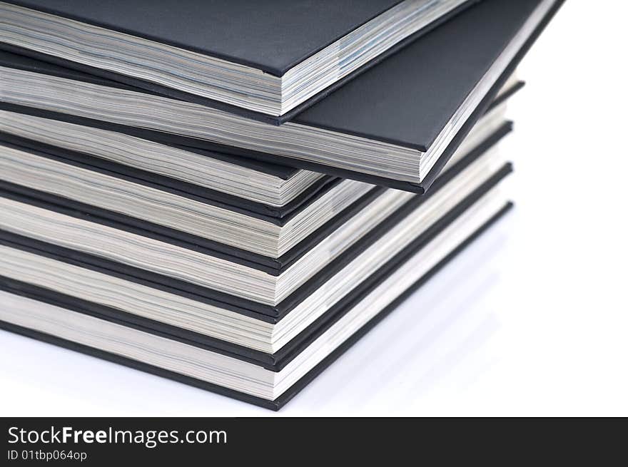 Pile books on the white table. Pile books on the white table