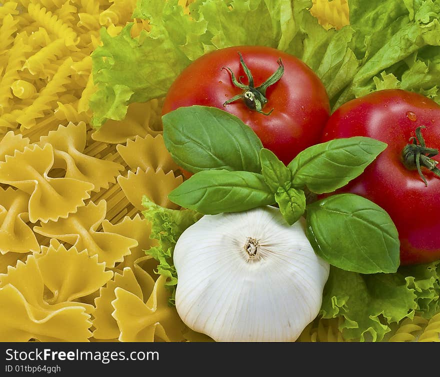 Red tomatoes garlic and pasta. Red tomatoes garlic and pasta