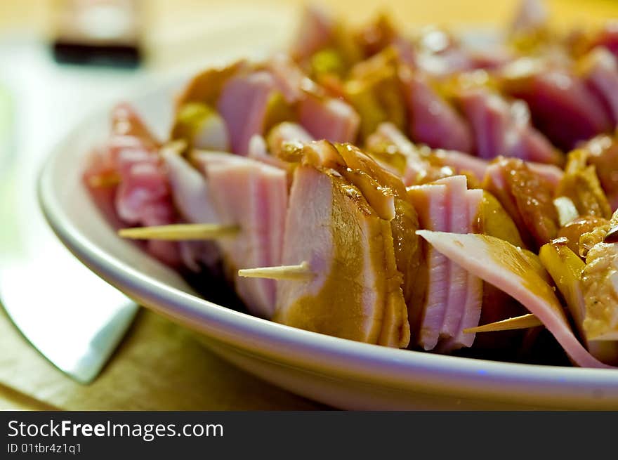 Pork shashlik in kitchen on white plate