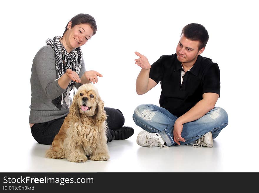 Girl, guy and american cocker spaniel over a white background