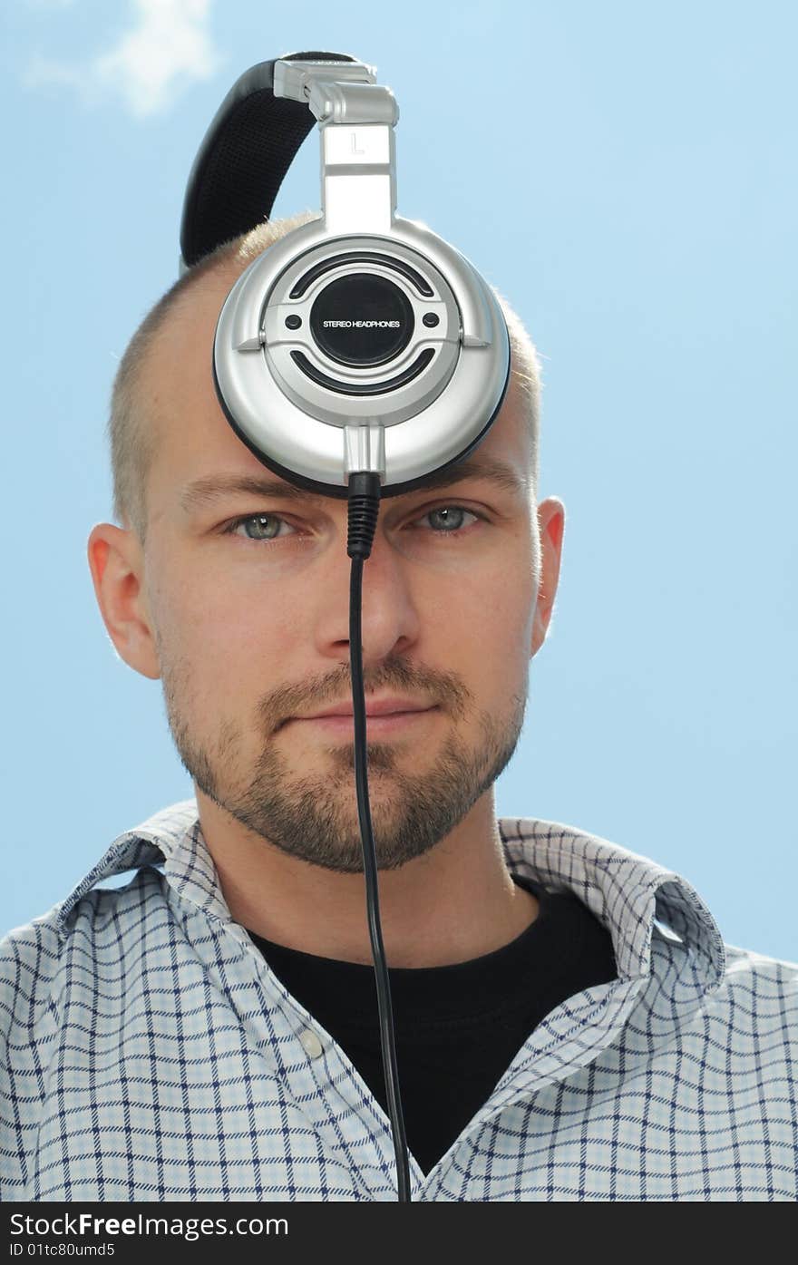 Cool man with headphones working as DJ. Cool man with headphones working as DJ