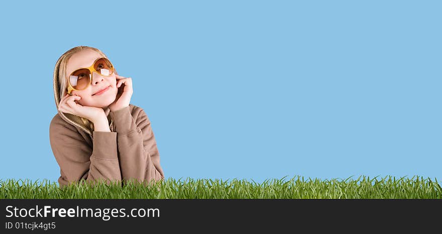 Happy woman in grass on a meadow