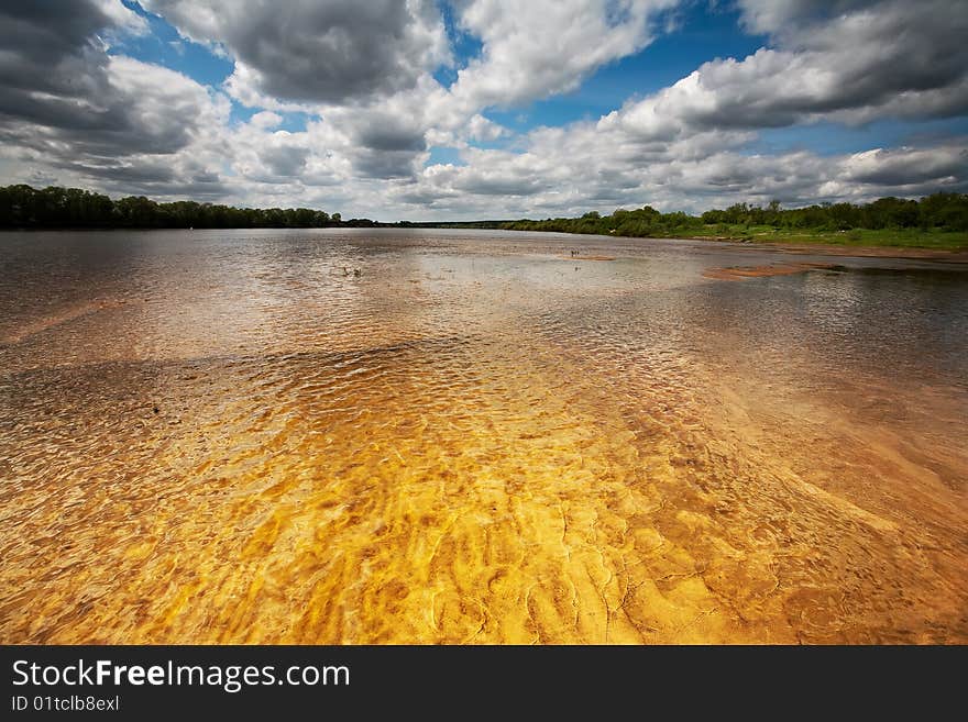 River panorama on a summer day with clouds and blue sky. River panorama on a summer day with clouds and blue sky